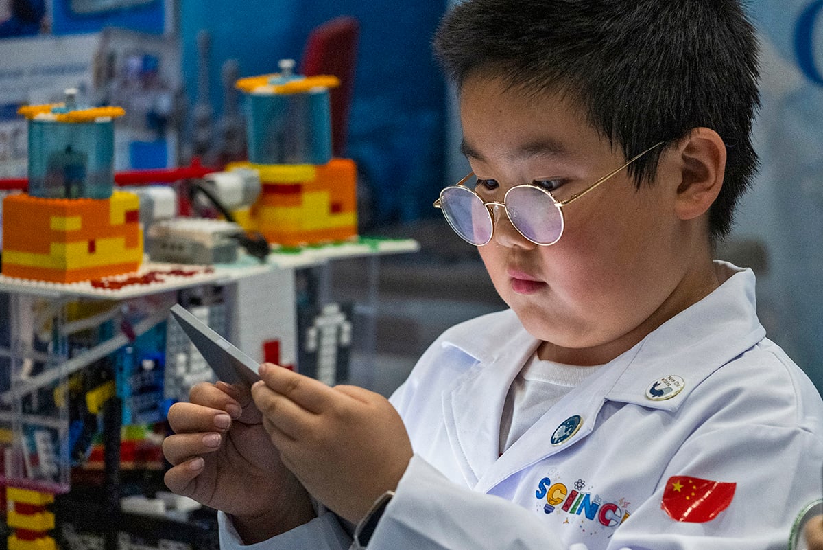 FIRST LEGO League student programming their robot at FIRST Championship.
