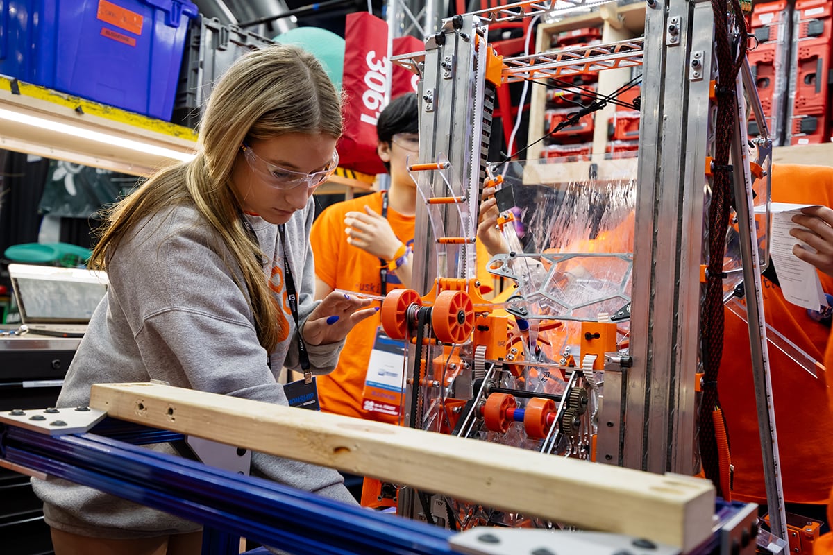 FIRST Robotics Competition students working on their robot at FIRST Championship